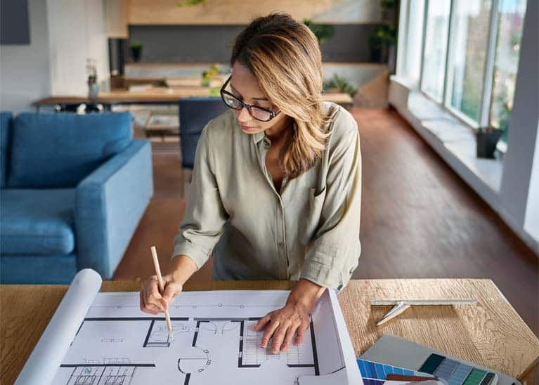 Designer working on the plans for a major home renovation