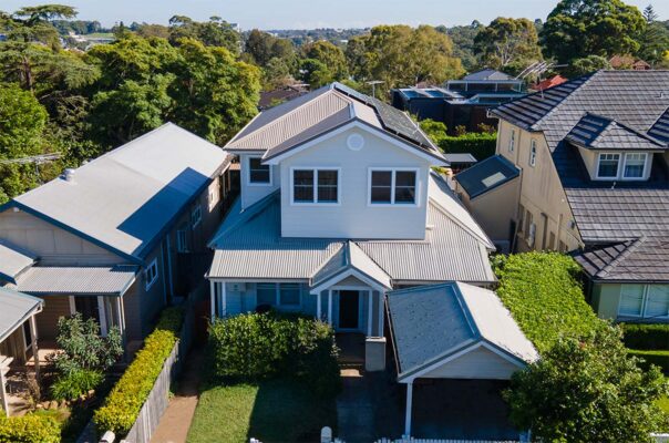 Photo of a two storey house, from an elevated angle, showing a new second level extension